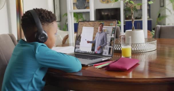 African American Boy Using Laptop Video Call Male Teacher Screen — Stockvideo
