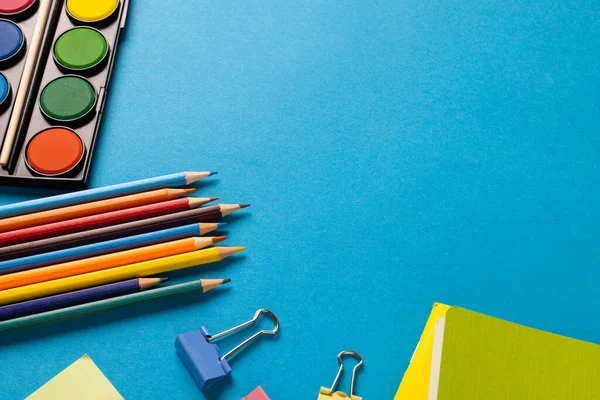 Composition Colorful School Items Watercolors Crayons Blue Surface Copy Space — Stockfoto