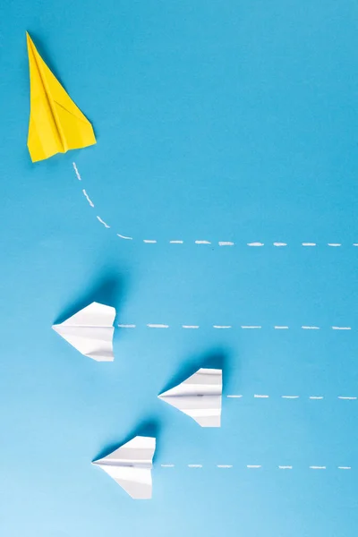 Image One Yellow Paper Plane Three White Paper Plains Blue — Stockfoto