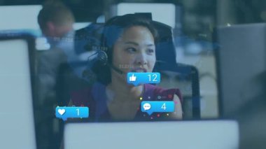 Animation of data processing and social media icons over asian businesswoman using phone headset. Global business, computing and digital interface concept digitally generated video.
