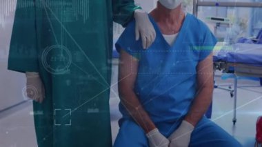 Animation of data processing over caucasian surgeons with face masks. Global medicine and digital interface concept digitally generated video.