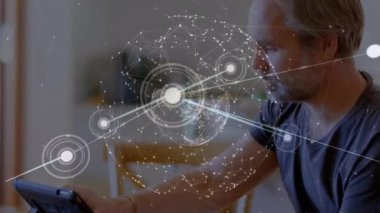 Animation of network of connections and globe over caucasian man. Global education, connections and digital interface concept digitally generated video.