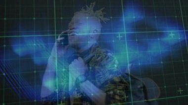 Animation of digital screen with blue lines over happy albino man using smartphone. Network, communication and technology concept digitally generated video.