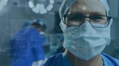Animation of digital interface over surgeon in operating theatre. global medicine, technology, data processing and digital interface concept digitally generated video.