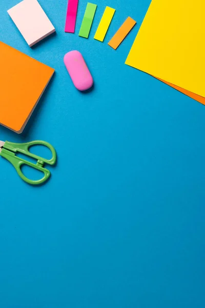 Vertical Composition Post Its Eraser Crayons Scissors Blue Surface Copy — Stockfoto
