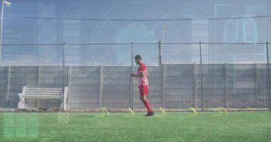 Animation of interface processing data over male footballer training on pitch jumping hurdles. Sports, competition, fitness and technology concept digitally generated video.