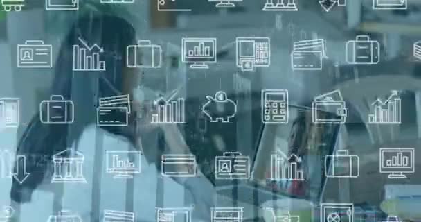 Animation Financial Icons Biracial Woman Having Video Call Laptop Business — стоковое видео