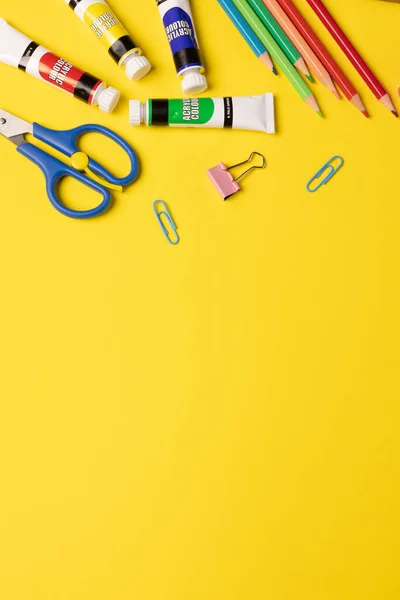 Imagine Various Office Supplies Plastic Utensils Paints Crayons Yellow Background — Stockfoto