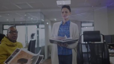 Animation of connections over diverse businesspeople in office. Network, connections, communication in business and technology concept digitally generated video.