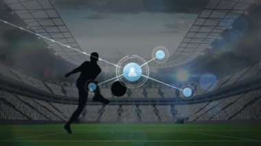 Animation of connections over male soccer player silhouette at stadium. Sport, training, connections and technology concept digitally generated video.