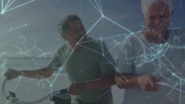 Sahilde bisiklete binen farklı çiftler arasındaki bağlantı ağının animasyonu. Dijital olarak oluşturulmuş küresel bağlantılar, bilgisayar ve dijital arayüz kavramı.