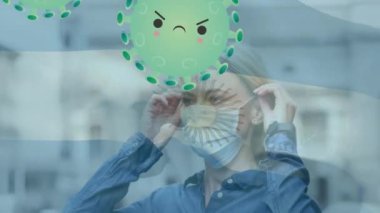 Animation of virus cells and flag of argentina over caucasian woman with face mask. Global pandemic, patriotism and digital interface concept digitally generated video.