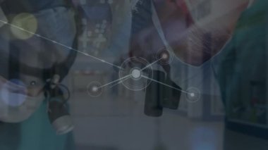 Animation of network of connections over surgeons in operating theatre. Global medicine, technology, data processing and digital interface concept digitally generated video.