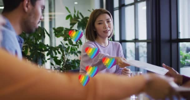 Multiple Rainbow Heart Icons Floating Group Diverse Office Colleagues Discussing — 图库视频影像