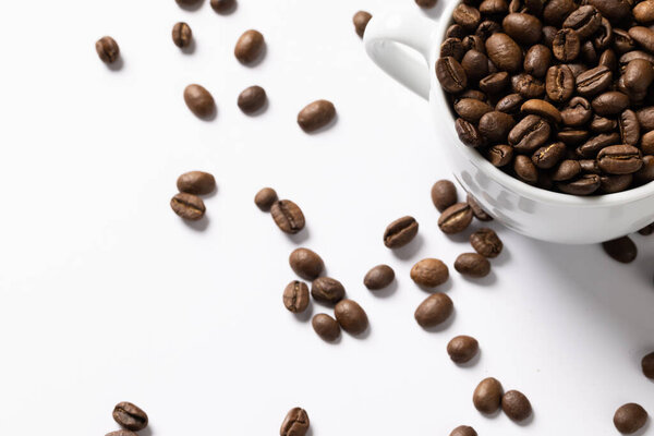 Image of pill of a coffee beans and cup of coffee beans on white background. Coffee, refreshment and beverages.