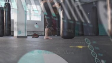 Animation of graph and data processing over caucasian woman boxing. Global sport, computing and digital interface concept digitally generated video.