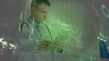 Animation of data processing on digital screen over caucasian male doctor with tablet. Health, medicine and technology concept digitally generated video.