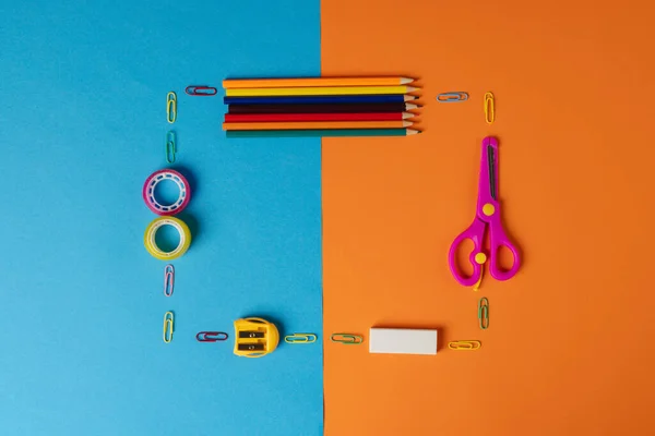 Composition Frame Made Crayons Scissors Other Items Blue Orange Surface — Stockfoto