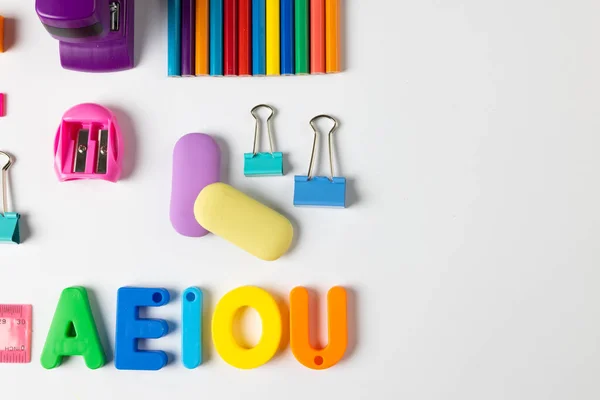 Composition Colorful School Equipment Letters Clips White Surface School Equipment — Stockfoto