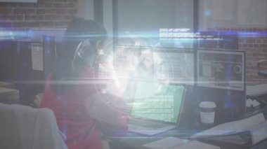 Animation of digital screen with globe over biracial woman using laptop in office. Business, working in office during covid 19 pandemic and technology concept digitally generated video.