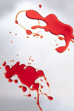 Composition of multiple red blood stains on white background. Halloween, autumn, tradition and celebration concept.