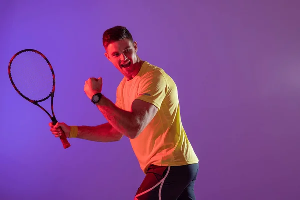 Happy Caucasian Male Tennis Player Tennis Racket Neon Pink Lighting — Stok fotoğraf