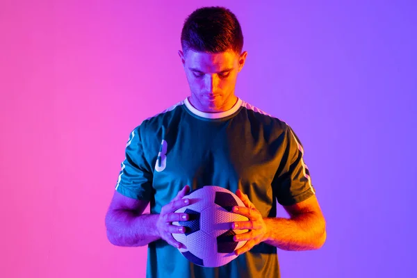 Caucasian Male Soccer Player Football Neon Pink Lighting Sport Movement — Foto Stock