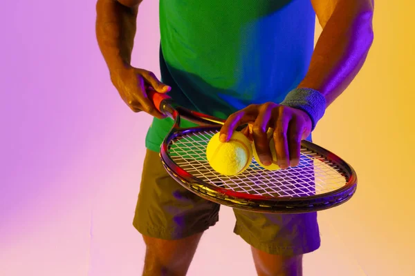 Image Midsection African American Male Tennis Player Violet Yellow Neon — ストック写真