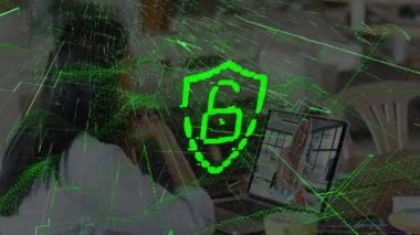 Animation of padlock icon over biracial businesswoman having video call with colleague. Global business and digital interface concept digitally generated video.