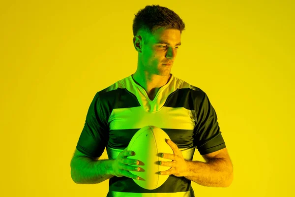 Caucasian Male Rugby Player Rugby Ball Yellow Lighting Sport Movement — 스톡 사진