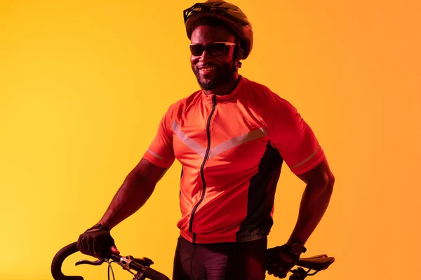 Image Happy African American Male Cyclist Looking Camera Yellow Lighting —  Fotos de Stock