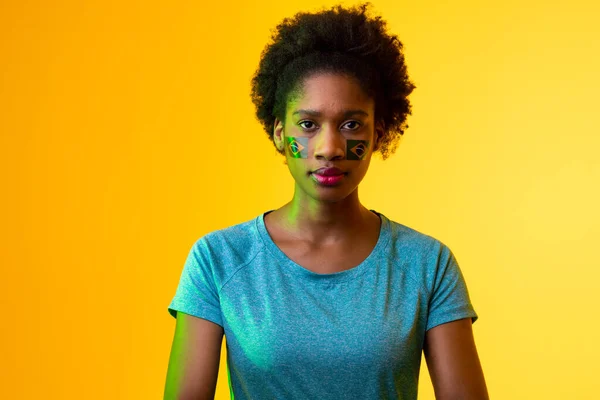 Image African American Female Soccer Fan Flag Portugal Yellow Lighting — Fotografia de Stock