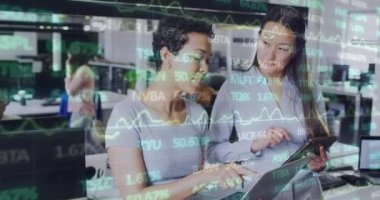 Animation of financial data and graphs over diverse female coworkers in office. Business, finance, economy and cooperation concept digitally generated video.