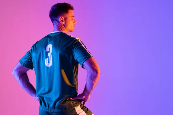 Caucasian Male Soccer Player Neon Pink Lighting Sport Movement Training — 图库照片