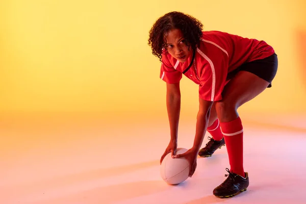 African American Female Rugby Player Rugby Ball Neon Yellow Lighting — Stok Foto