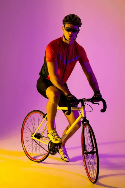 Portrait Caucasian Male Cyclist Bicycle Pink Lighting Sport Movement Training — Φωτογραφία Αρχείου