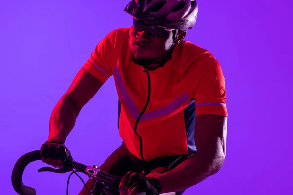 African American Male Cyclist Bicycle Neon Pink Lighting Sport Movement — Φωτογραφία Αρχείου