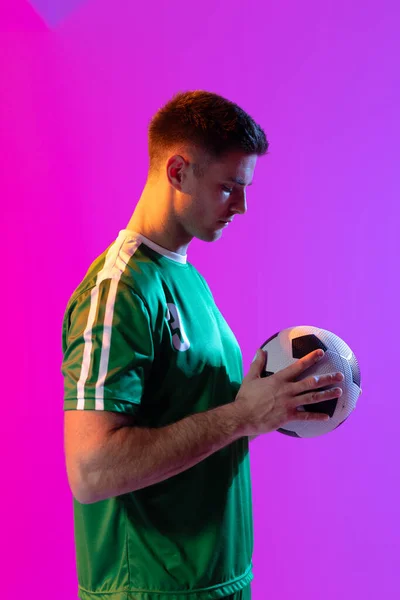 Caucasian Male Soccer Player Football Neon Pink Lighting Sport Movement — Stockfoto
