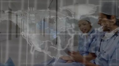 Animation of world map over two diverse doctors. Global medicine, technology, data processing and digital interface concept digitally generated video.
