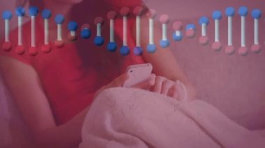 Akıllı telefon kullanıp koltukta oturan Asyalı kadının DNA 'sının canlandırılması. Sağlık, tıp ve bilim konsepti dijital olarak üretilen video.