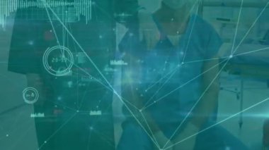 Animation of data processing over caucasian surgeons with face masks. Global medicine and digital interface concept digitally generated video.