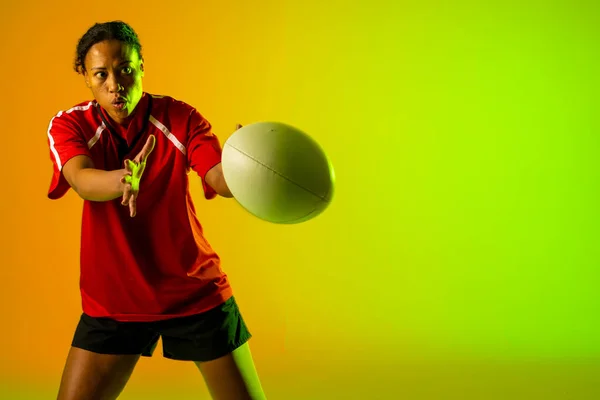 African American Female Rugby Player Rugby Ball Neon Green Lighting — Stok Foto