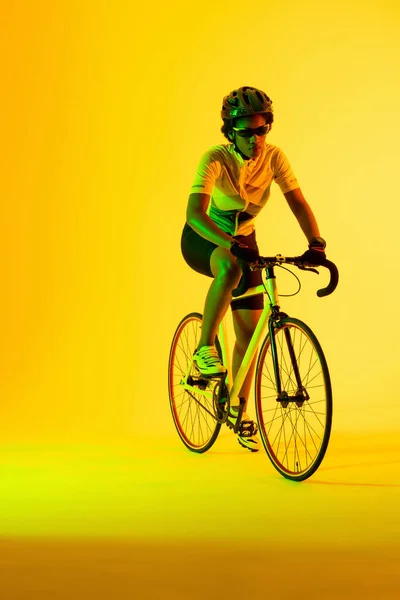 Vertical Image African American Female Cyclist Riding Bike Yellow Lighting — ストック写真