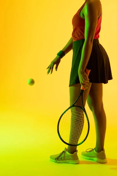 Vertical Image Midsection African American Female Tennis Player Yellow Lighting — Stockfoto