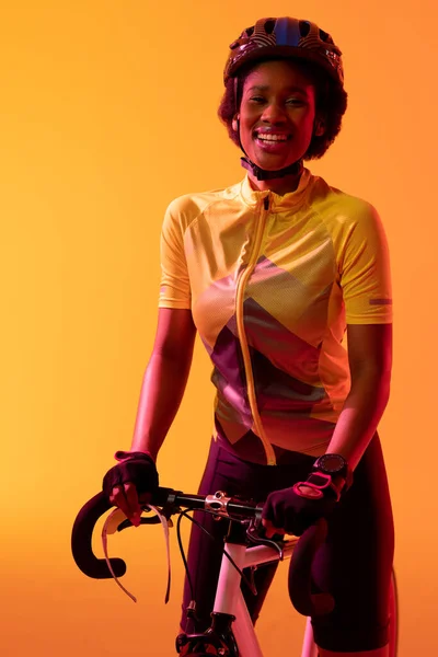 Vertical Image Happy African American Female Cyclist Bike Neon Orange — Zdjęcie stockowe