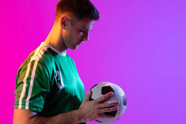 Caucasian Male Soccer Player Football Neon Pink Lighting Sport Movement — Stock fotografie
