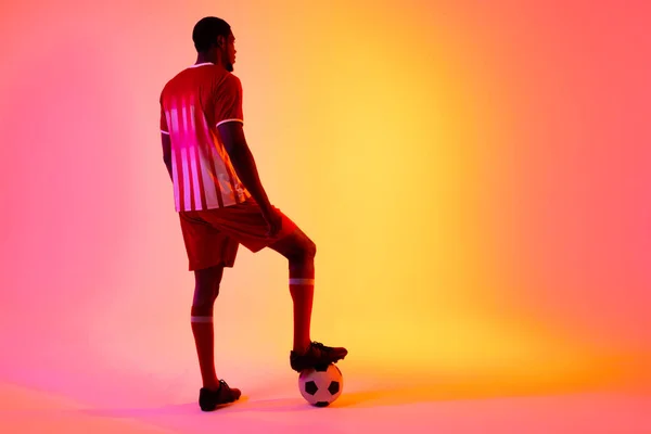 African American Male Soccer Player Football Neon Pink Lighting Sport — Zdjęcie stockowe