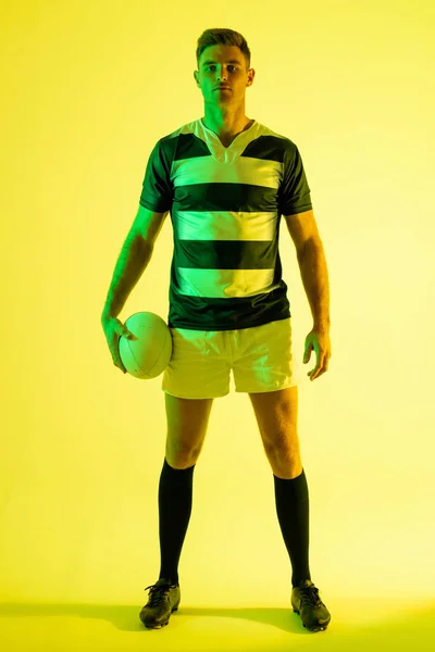 Portrait Caucasian Male Rugby Player Rugby Ball Yellow Lighting Sport — 图库照片