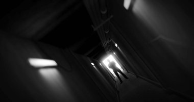 Image of man silhouette standing in dark corridor. Horror, fright, halloween and computer games concept digitally generated image.