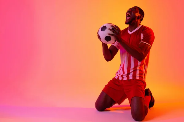 Happy African American Male Soccer Player Football Neon Pink Lighting — 스톡 사진